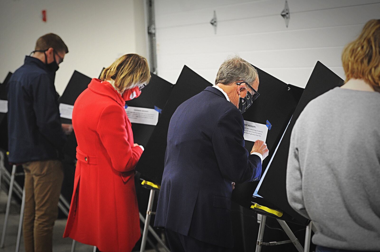 Governor Mike DeWine along with his wife Fran, vote at the Cedarland Event Center in Cedarville on Tuesday. MARSHALL GORBY\STAFF