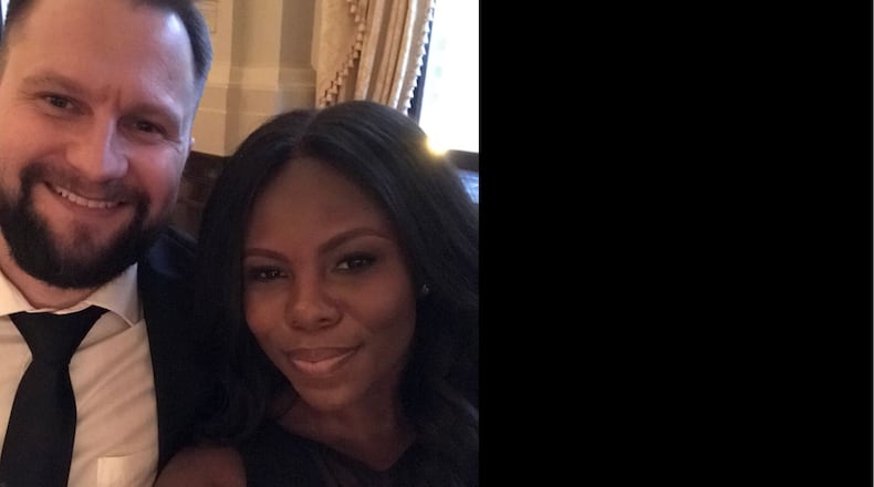 Sugarcreek Twp. resident Nichole Smith, the programming director of Pink Ribbon Girls, is Dayton of the Week. She is pictured with her husband, Adam.