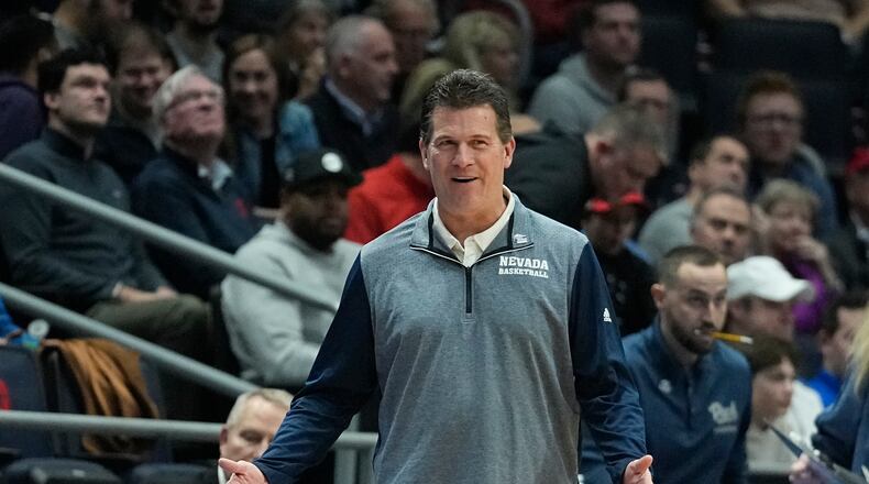 Nevada head coach Steve Alford questions a call during the first half of a First Four college basketball game against Arizona State in the NCAA men's basketball tournament, Wednesday, March 15, 2023, in Dayton, Ohio. (AP Photo/Darron Cummings)