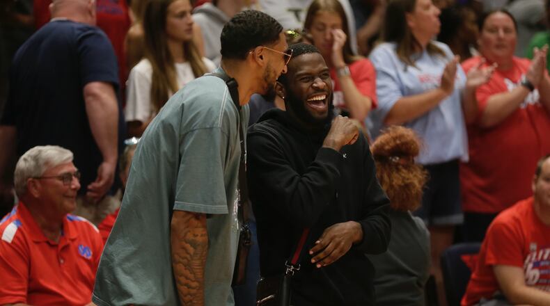 Jalen Crutcher and Obi Toppin watch from behind the Red Scare bench during a game against CitiTeam in the first round of The Basketball Tournament on Sunday, July 24, 2022, at UD Arena. David Jablonski/Staff