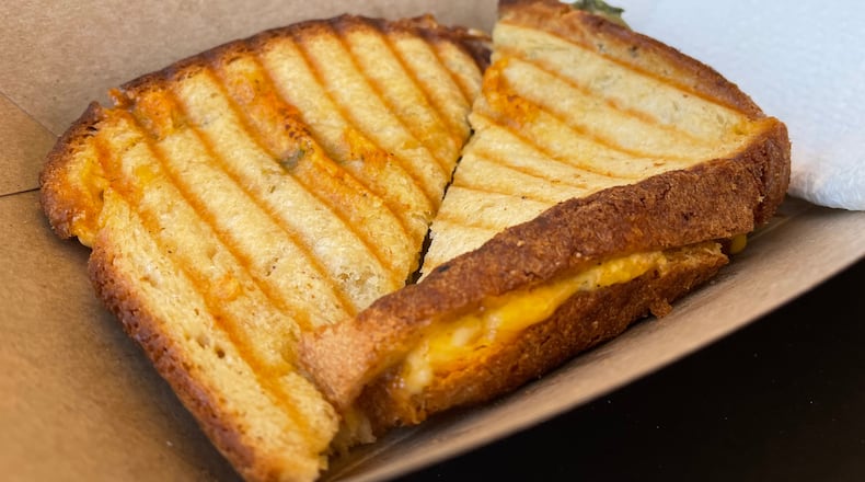 Socialite Cafe, a European-style cafe in Kettering, is open at 4011 Marshall Road. Pictured is The Jackie O' Cali Grilled Cheese. NATALIE JONES/STAFF
