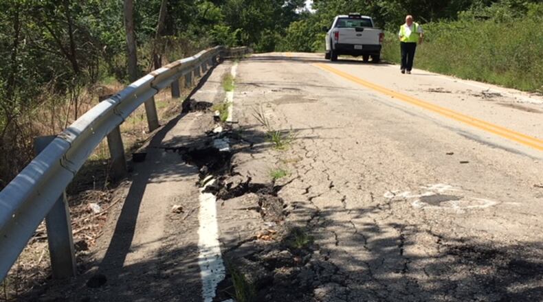 Lower Miamisburg Road was shut down between Dee Avenue in Miamisburg and South Union Road in Miami Twp. because of severe damage. Part of the road is splitting due to its location on a significant hillside. The road in Miamisburg and Miami Twp. is slipping and failing after water getting underneath the road, officials said. STAFF.