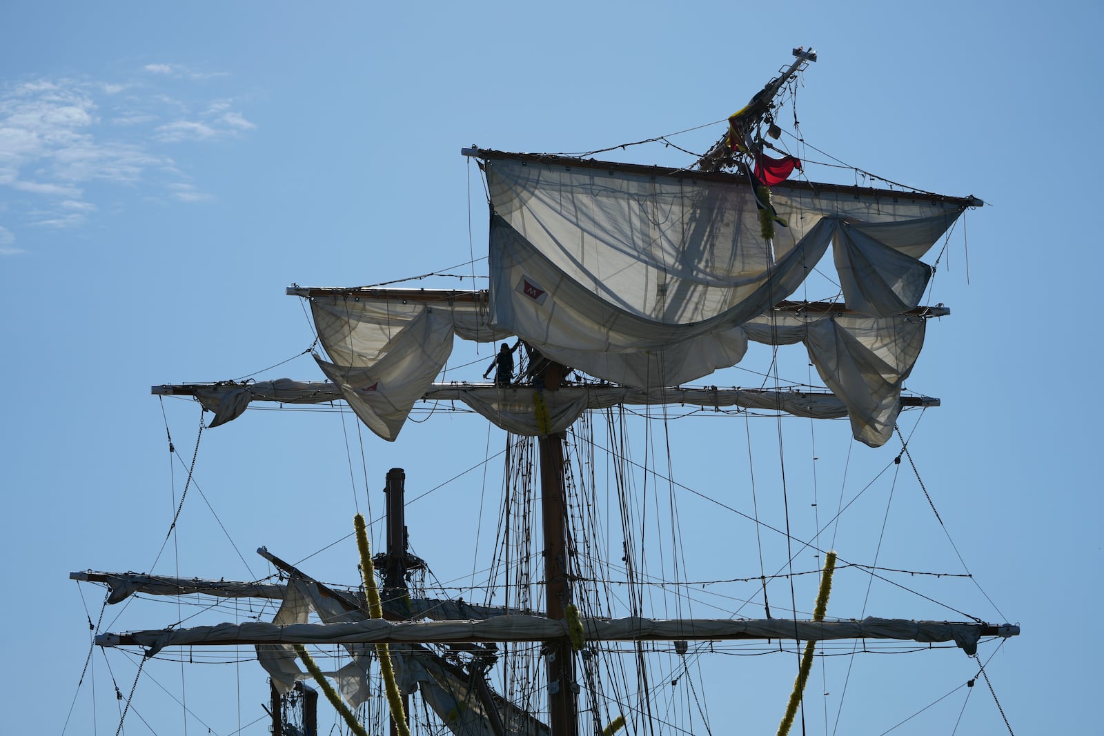 People work the Cuauhtemoc, a masted Mexican Navy training ship, after it collided with the Brooklyn Bridge in New York, Monday, May 19, 2025. (AP Photo/Seth Wenig)