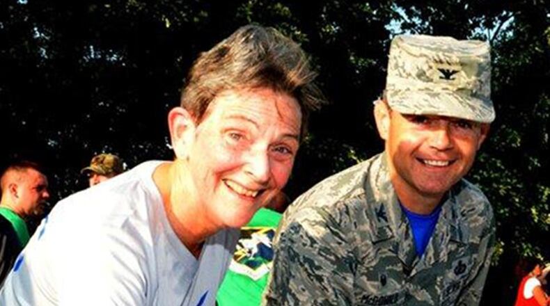 Gen. Ellen Pawlikowski, Air Force Materiel Command commander, and Col. Bradley McDonald, 88th Air Base Wing commander, add their names to the hope banner in support of the annual Suicide Awareness 5K Run/Walk run at Wright-Patterson Air Force Base Aug. 25. (U.S. Air Force photo/Al Bright)