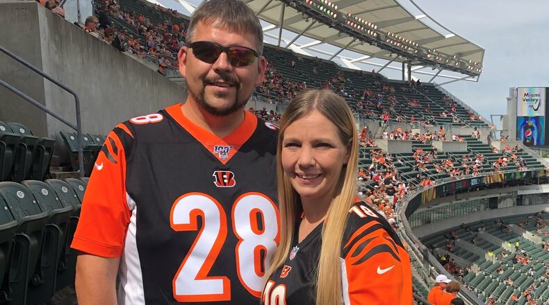 Hamilton resident Tonya Metcalf and her husband, Hiram, are headed to the Nov. 26 football game between Ohio State and archrival Michigan after Metcalf won a pair of tickets in the Community Blood Center raffle. CONTRIBUTED