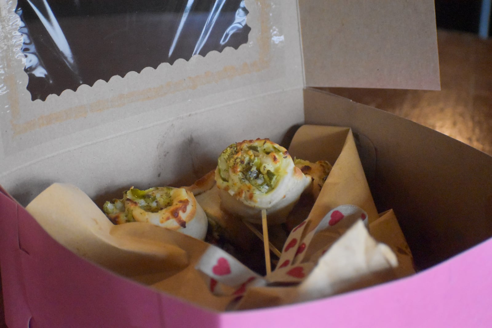 A vegetarian pizza roll bouquet option features the fan-favorite pickle-and-cheese rolls, packaged in a gift-style box at Yellow Cab Tavern. CONTRIBUTED