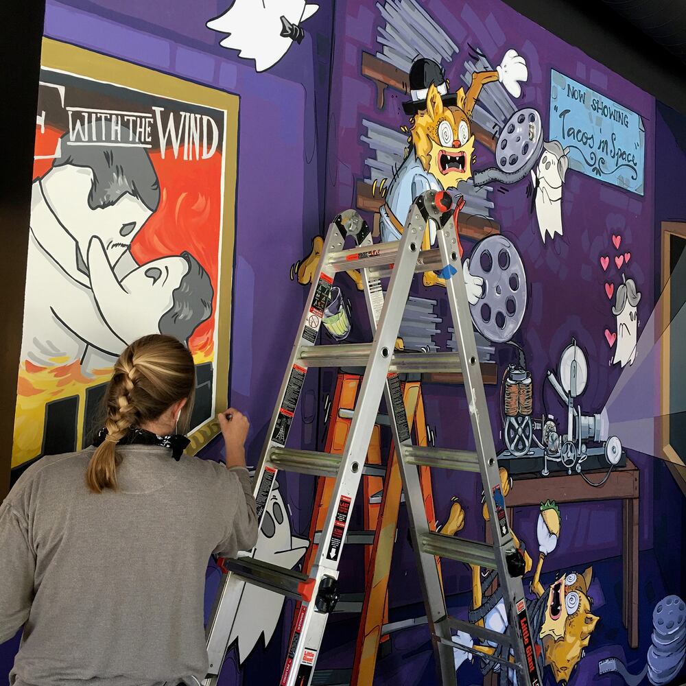 PHOTOS: Wild and wacky murals take over new restaurant at The Greene