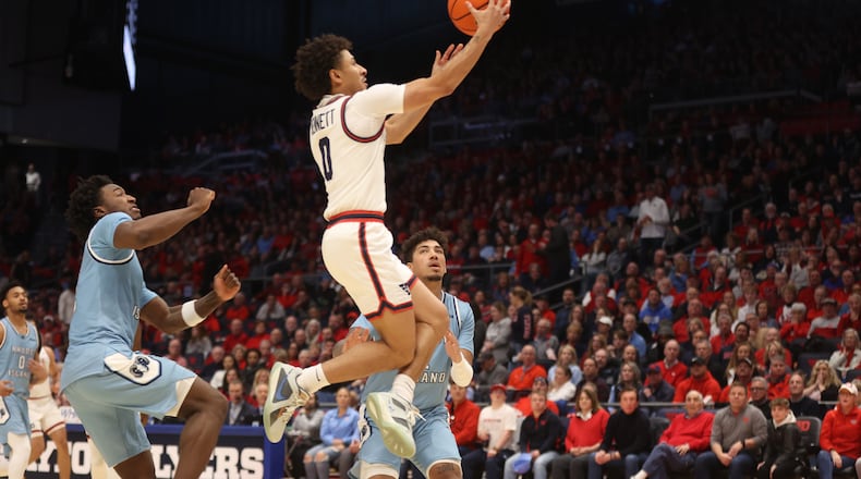 Dayton's Javon Bennett scores against Rhode Island on Saturday, Jan. 20, 2024, at UD Arena. David Jablonski/Staff