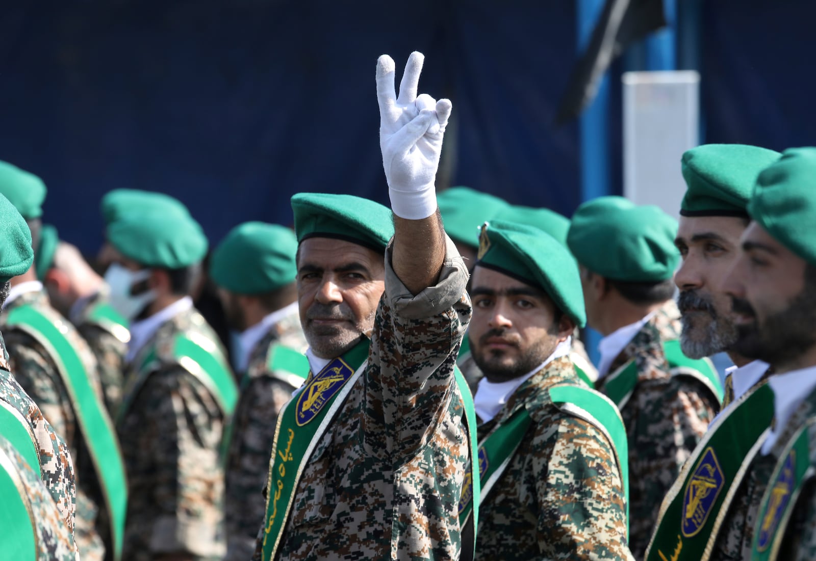 FILE - A member of Iran's Basij paramilitary force flashes a victory sign during a military parade outside of Tehran, Iran, on Sept. 22, 2022. (AP Photo/Vahid Salemi, File)
