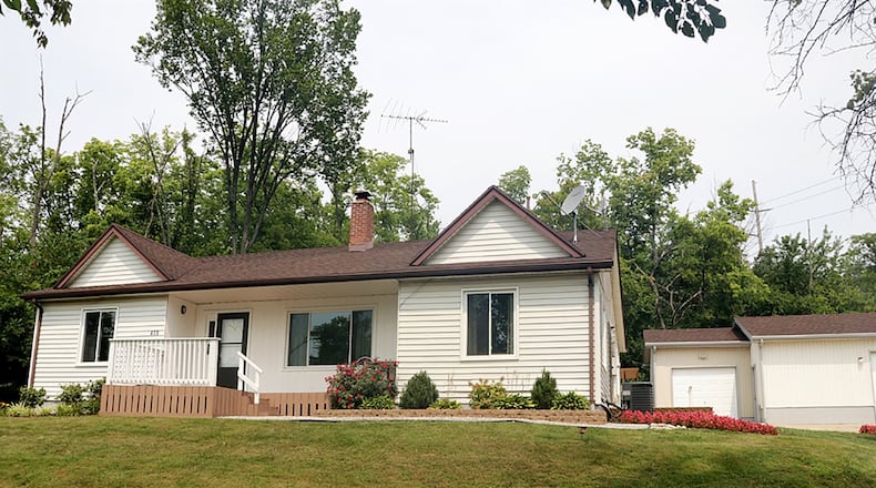 The 3-bedroom ranch offers about 1,950 sq. ft, of living space. A gravel entry drive transforms into a large concrete driveway with an extra parking pad and extends to the front of the 3-car, detached garage. CONTRIBUTED PHOTO BY KATHY TYLER