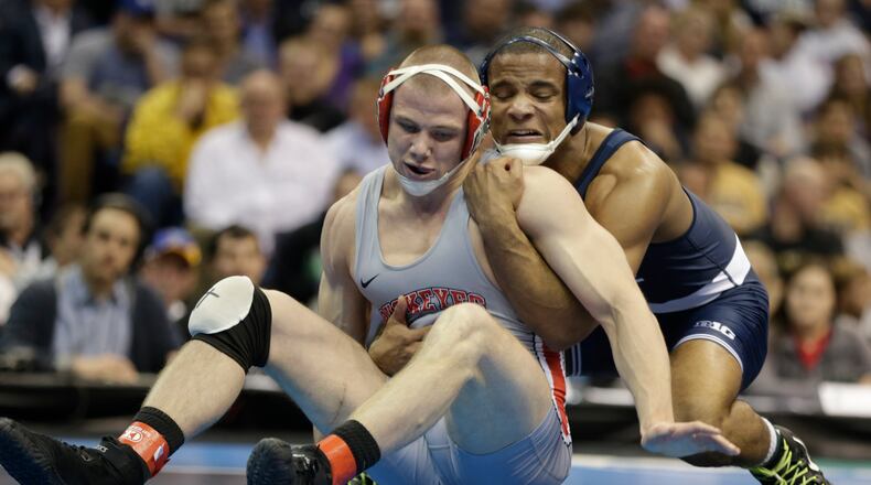 Penn State’s Mark Hall wrestles Ohio State’s Bo Jordan in the 174-pound match in the championship round of the NCAA Division I wresting championships, Saturday, March 18, 2017, in St. Louis. (AP Photo/Tom Gannam)
