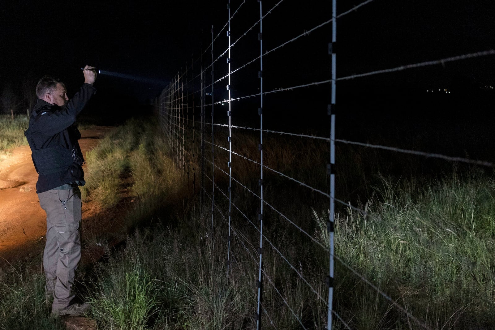 Dewet Ungerer, an AfriForum coordinator, patrols a road during a neighborhood and farm security watch operation in Bashewa area, near Pretoria, South Africa, March 27, 2025. (AP Photo/Alet Pretorius)