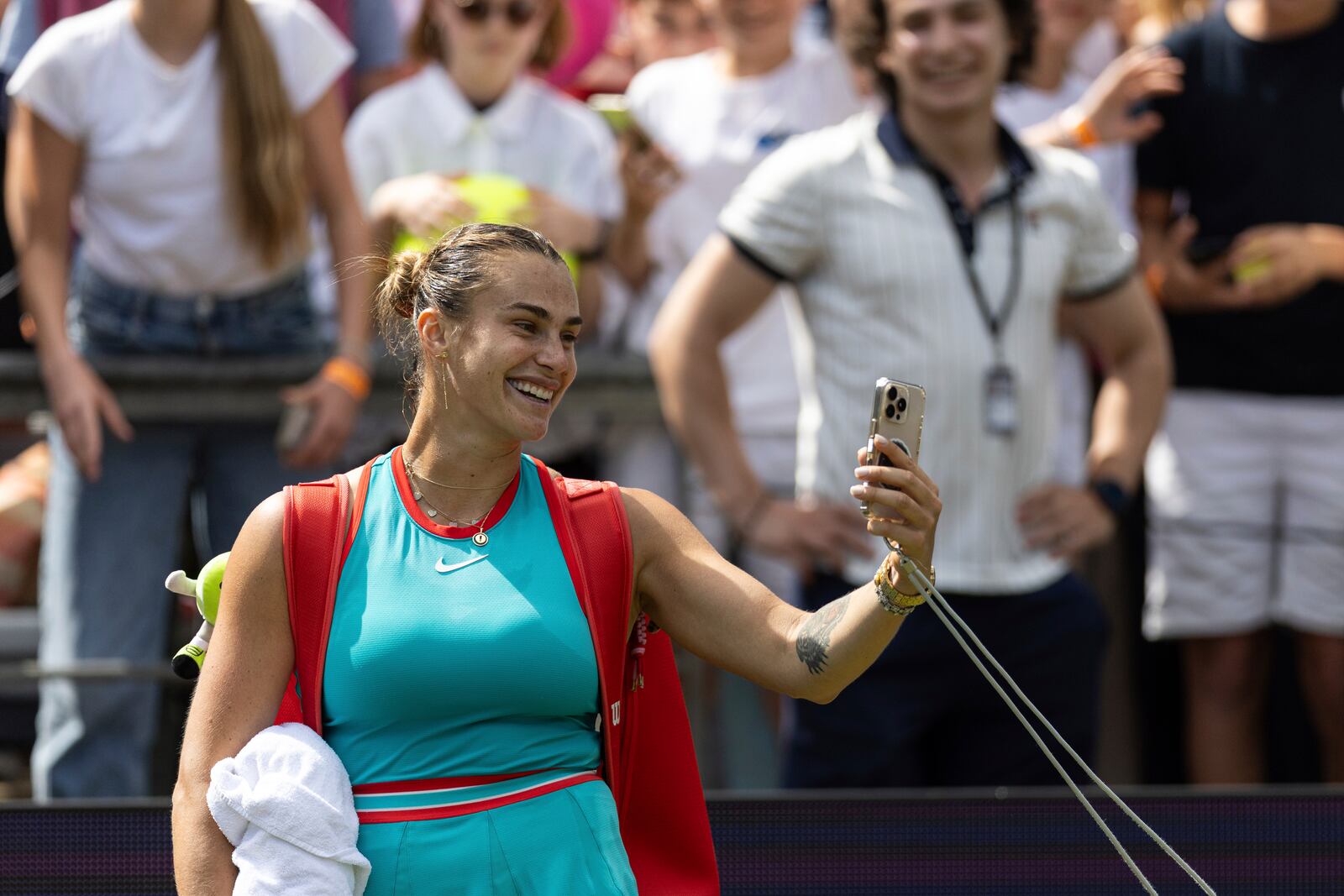 Belarus' Aryna Sabalenka takes a selfie after playing Switzerland's Rebeka Masarova during the Berlin WTA tennis tournament in Berlin, Germany, Thursday, June 19, 2025. (Hannes P. Albert/dpa via AP)