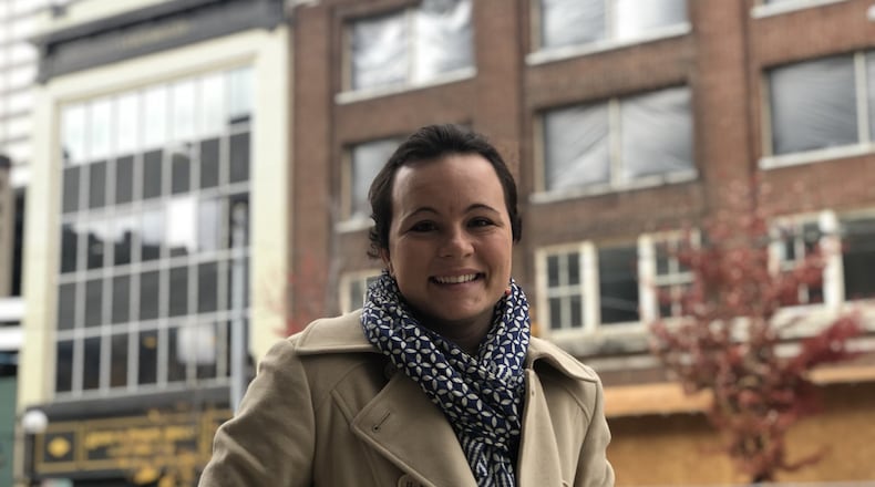 Casey Van Voorhis, 30, stands across the street from 111 E. Third St., which will be home to her new restaurant, Grist. She and her husband own and operate Grist Provisions, which sells pasta, breads and other items on Wayne Avenue in the Oregon District. CORNELIUS FROLIK / STAFF