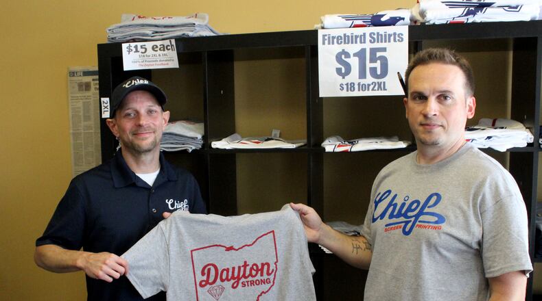 Chief Screen Printing owners Anthony Tomlinson (right) and James Webster (left) have raised nearly $5,500 through the sale of Dayton Strong T-shirts.