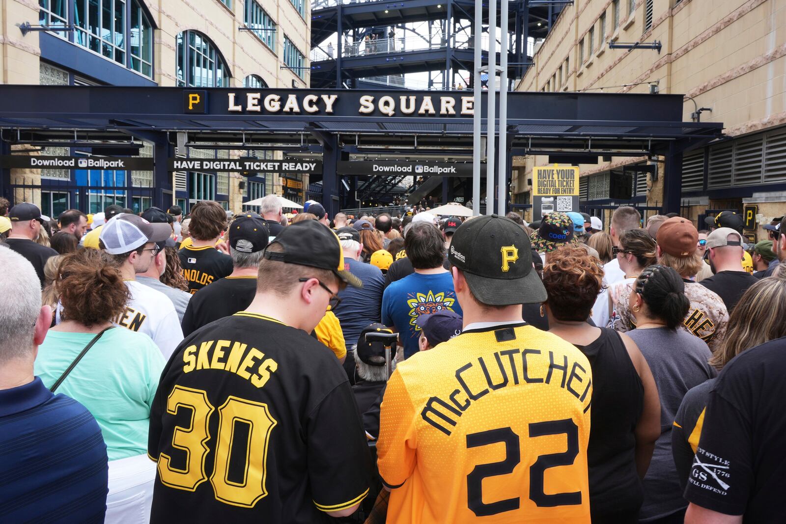 Fans line up outside PNC Park for a baseball game between the Pittsburgh Pirates and the Cleveland Guardians with Pirates' Paul Skenes pitching and having his bobblehead distributed in Pittsburgh, Saturday, April 19, 2025. (AP Photo/Gene J. Puskar)