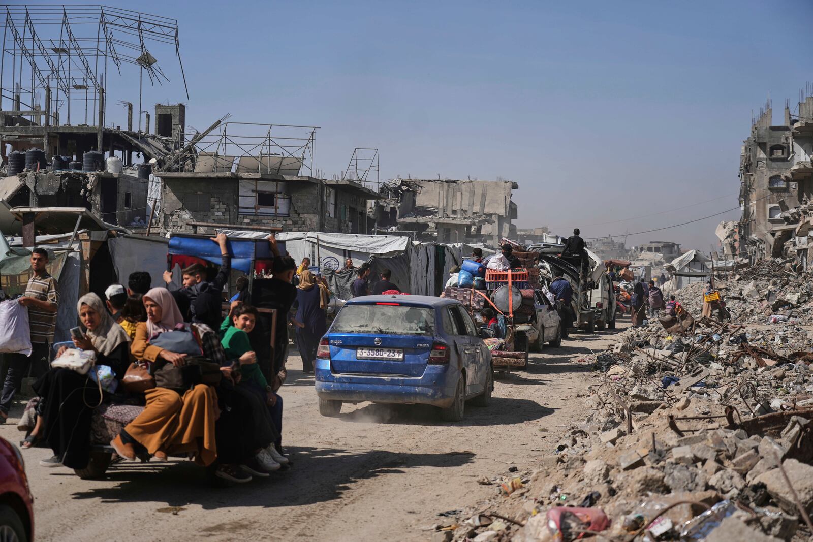 Displaced Palestinians fleeing Beit Lahia amid ongoing Israeli military operations in the Gaza Strip arrive in Jabalia, northern Gaza, on Friday, May 16, 2025. (AP Photo/Jehad Alshrafi)