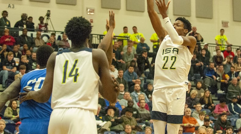 Keon Ambrose of ISA Andrews Osborne follows in a missed shot for a dunk against Hillcrest Prep on Friday night during the opening game of Flyin’ To The Hoop. Ambrose had 18 points and 20 rebounds to lead ISA to an 81-68 victory. Jeff Gilbert/CONTRIBUTED