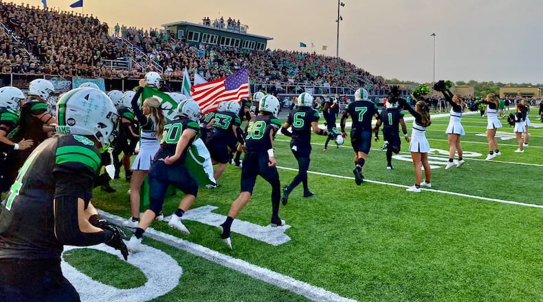 Badin High School’s first home football game Friday evening was 60 years in the making. And a standing room only crowd packed into the school’s first football game in its recently opened stadium and thousands turned out to join in to be part of Butler County prep sports history. (Photo By Michael D. Clark/Journal-News)