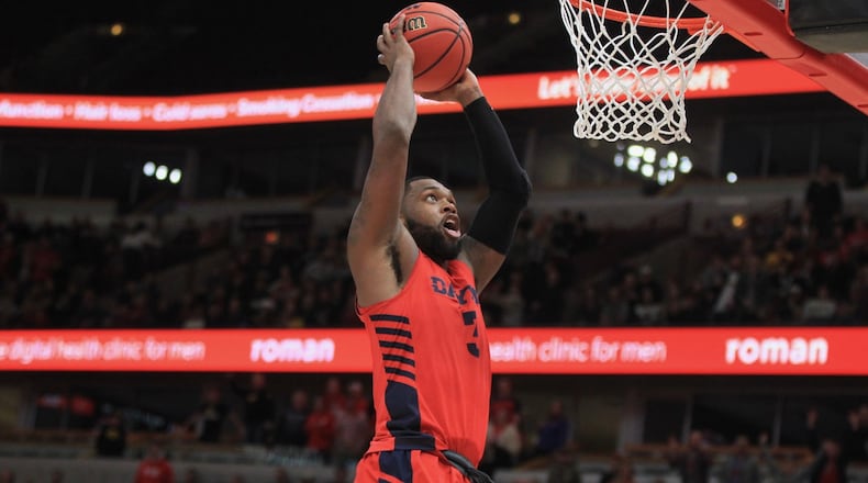 Dayton’s Trey Landers dunks against Colorado on Saturday, Dec. 21, 2019, at the United Center in Chicago. David Jablonski/Staff