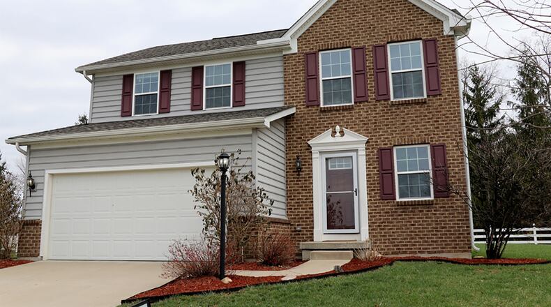 This 3-bedroom, Colonial-style 2-story has about 1,720 sq. ft. of living space with open social areas and additional living space within the basement. The home is on a cul-de-sac and has a 2-car garage. CONTRIBUTED PHOTO BY KATHY TYLER