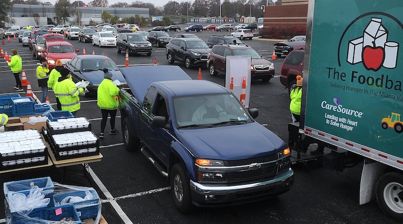 Miami Valley Meals hosted a Turkey Takeaway event at the University of Dayton Arena, Wednesday, Nov. 22, 2023 for those experiencing food insecurity. MARSHALL GORBY\STAFF
