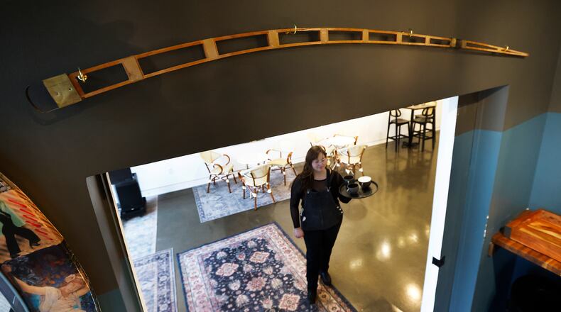 The Gather by Ghostlight coffeeshop in the Dayton arcade is displaying a piece of aviation history after a customer gifted them a rib from the Wright Flyer replica constructed in 2003 as part of the 100 years of flight celebration. The rib is hanging above the doorway to the shop's jazz room. MARSHALL GORBY\STAFF