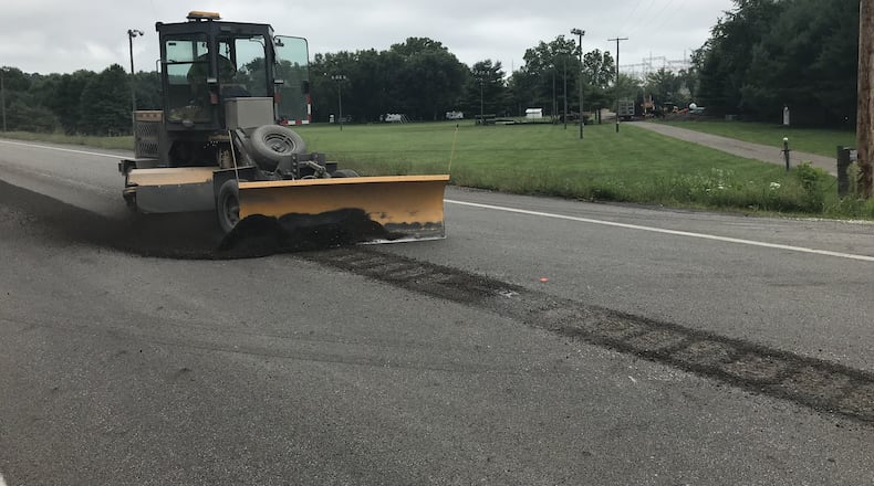 Ohio department of transportation installs rumble strips on roads to keep drivers from weaving into wrong lanes.