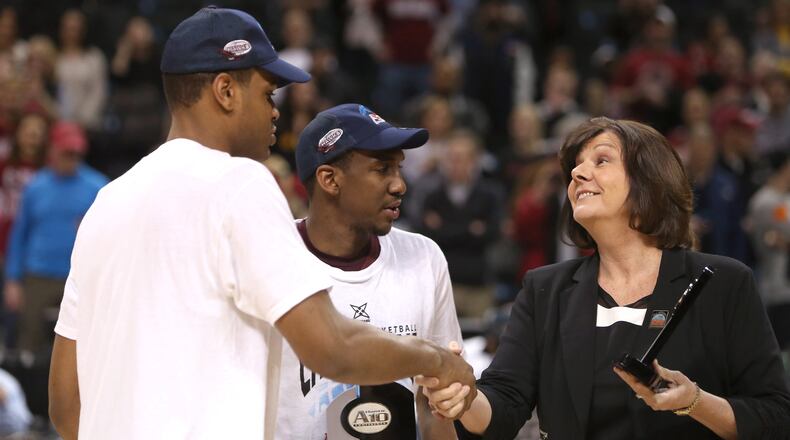 Ronald Roberts. Jr. and Langston Galloway, of the Saint Joseph's Hawks, are presented with A-10 All-Championship Team Awards by Atlantic 10 Commissioner Bernadette V. McGlade after defeating the Virginia Commonwealth Rams during the Championship game of the 2014 Atlantic 10 Men's Basketball Tournament at Barclays Center on March 16, 2014 in the Brooklyn borough of New York City. (Photo by Mike Lawrie/Getty Images)