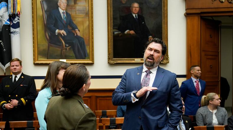 Rep. Morgan Luttrell, R-Texas, talks before the start of the House Armed Services Committee hearing on the Department of the Navy's budget request for fiscal year 2024, on Capitol Hill in Washington, Friday, April 28, 2023. (AP Photo/Carolyn Kaster)