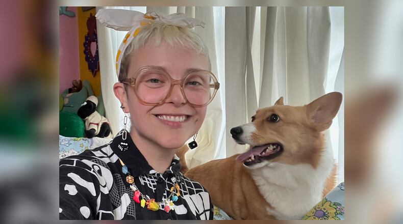 Dayton-based multimedia artist Sydney Joslin-Knapp with Daisy the Corgi. Joslin-Knapp specializes in colorful larger-than-life installations, drawings, and embroidery inspired by pop culture and local history. CONTRIBUTED PHOTO