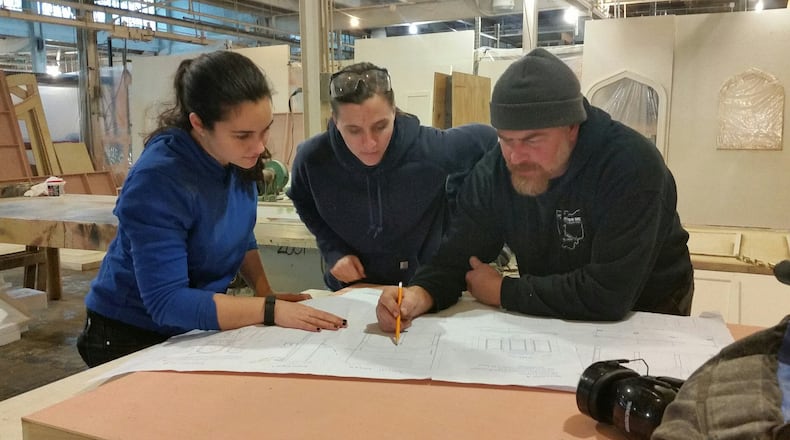 Working on the set for Dayton Opera are (l-r) carpenters Molly Lamperis and Abby Kuchar and technical director Tristan Cupp. SUBMITTED PHOTO