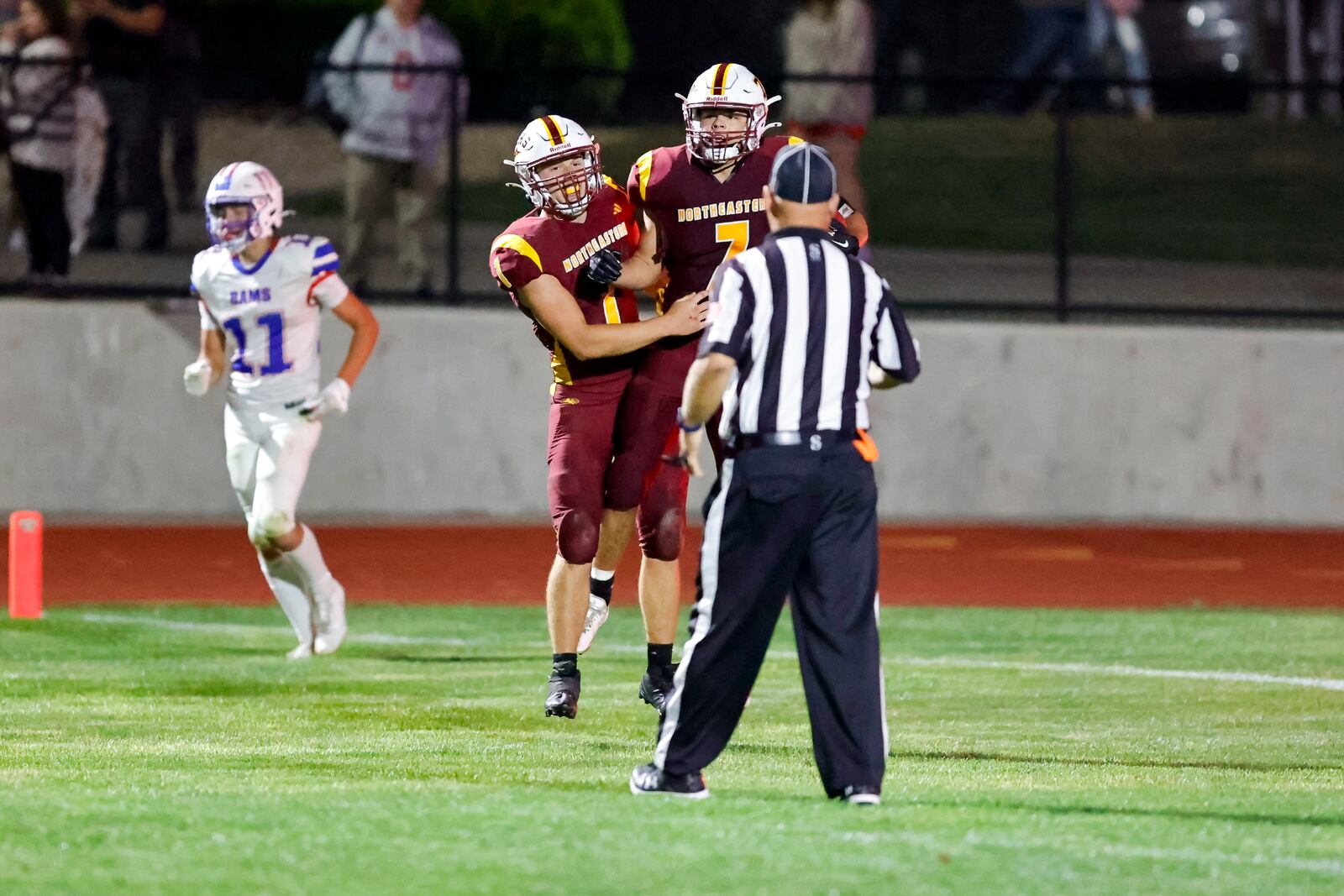 Northeastern High School seniors Cody Houseman (left) and Jackson Jones celebrate after Jones scored a touchdown during their 32-0 win over Greeneview on Friday, Sept. 5 at Conover Field in Springfield. MICHAEL COOPER/STAFF