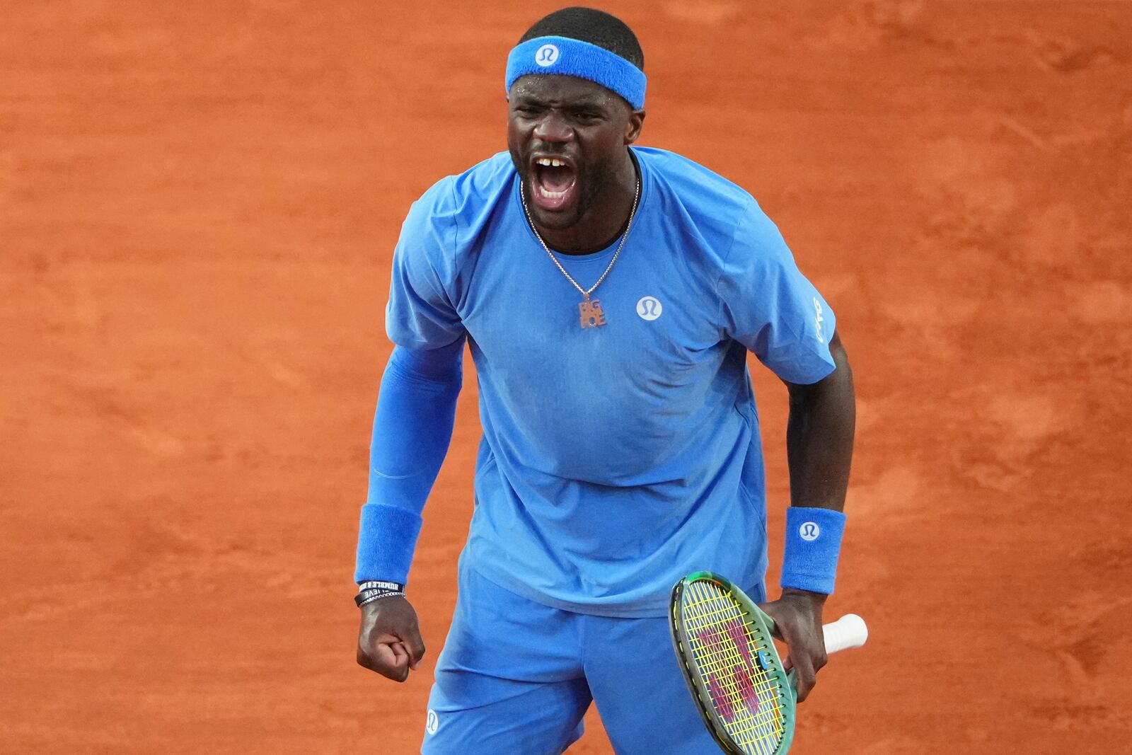 Frances Tiafoe of the U.S. celebrates beating Germany's Daniel Altmaier during their fourth round match of the French Tennis Open, at the Roland-Garros stadium, in Paris, Sunday, June 1 2025. (AP Photo/Lindsey Wasson)