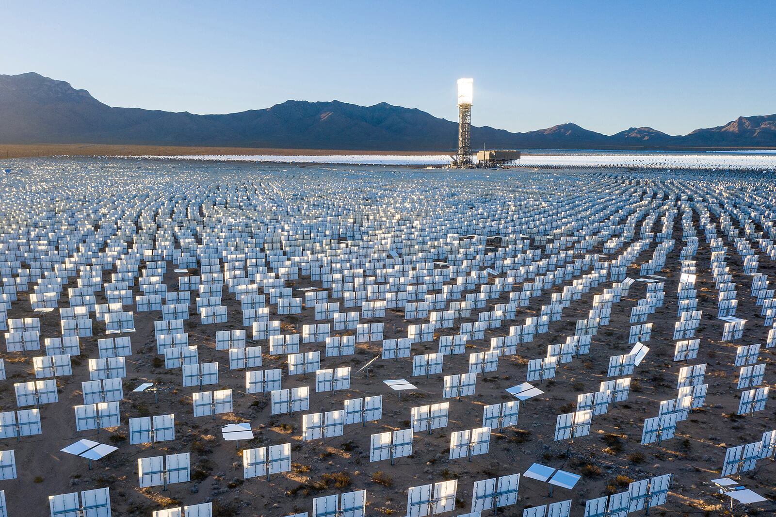 FILE -Solar panels line the Ivanpah Solar Electric Generating System in San Bernardino County, Calif., on Monday, Nov. 29, 2021. (AP Photo/Noah Berger,File)