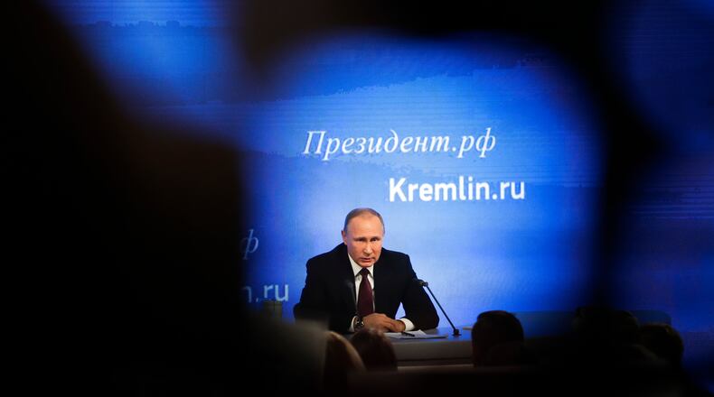 Russian President Vladimir Putin speaks during his annual news conference in Moscow, Russia, Friday, Dec. 23, 2016. Putin says U.S. Democrats should have apologized to American voters over the information revealed by hackers who posted Democratic National Committee e-mails. (AP Photo/Pavel Golovkin)