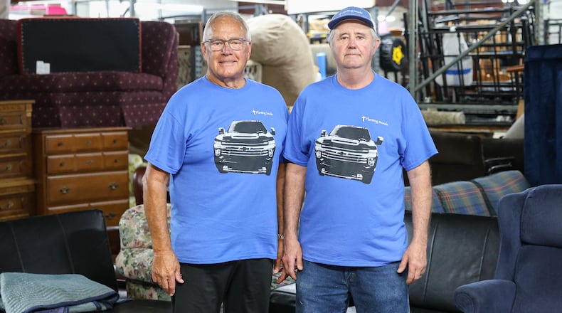 Brad Hausfeld (left) and Dannie Ball are co-founders of Planting Seeds in Springboro, which accepts donations of new and lightly used furniture, appliances, and household items and distribute these items to those in need and without means. BRYANT BILLING / STAFF
