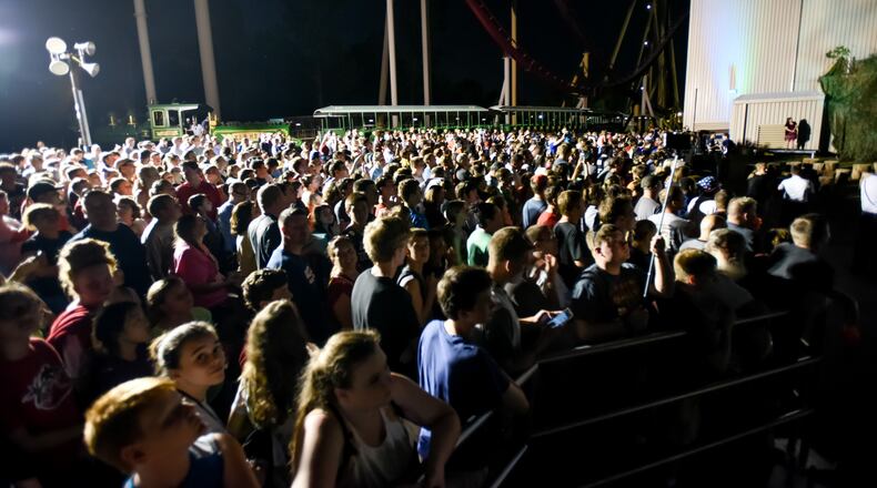 Hundreds waited in line and gathered for an announcement just after 10 p.m. that turned out to be the Mystic Timbers wooden roller coaster Thursday night, July 29, 2016, at Kings Island Amusement Park in Mason. The coaster will be completed in spring of 2017. NICK GRAHAM/STAFF