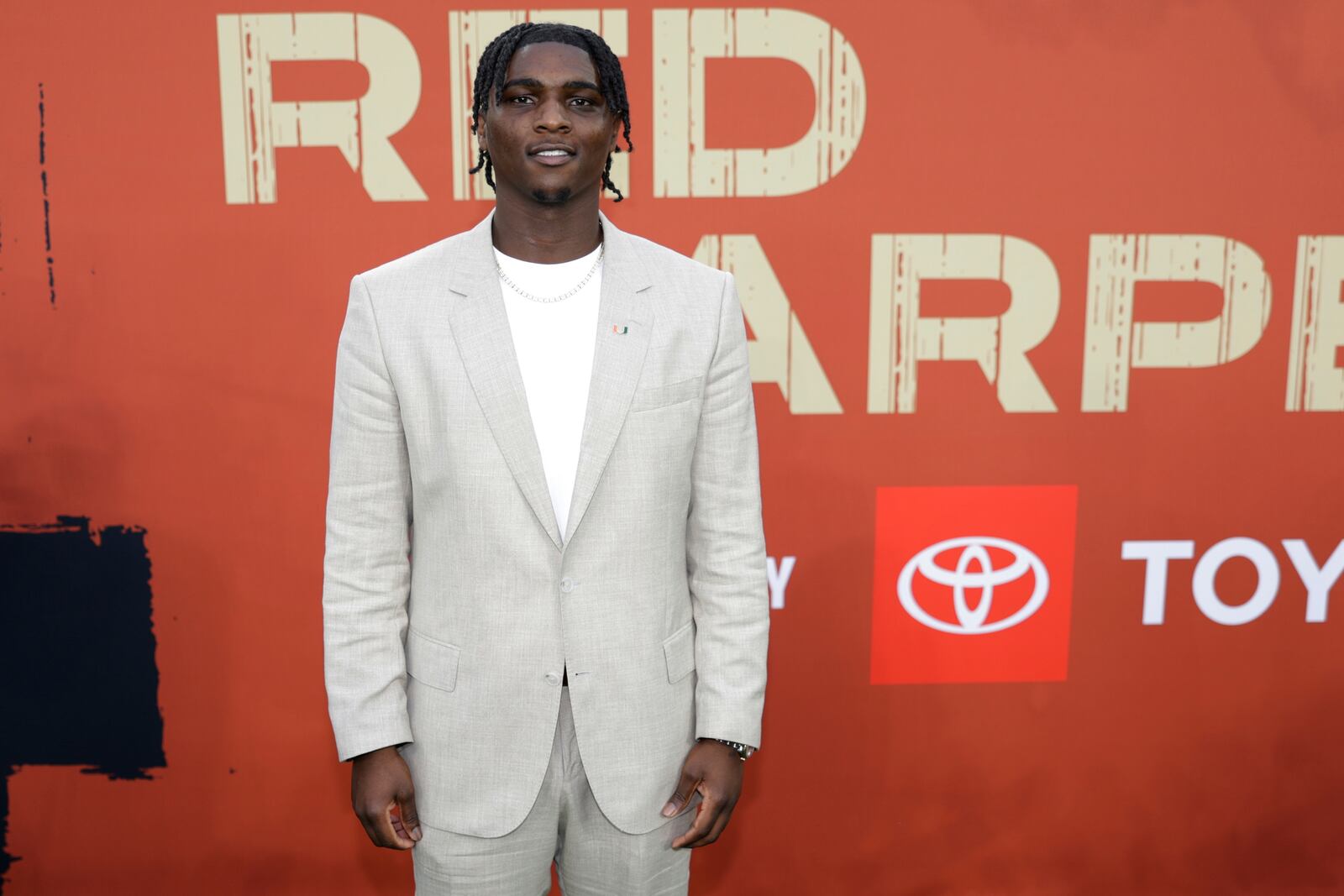 Miami quarterback Cameron Ward poses on the carpet before first round of the NFL football draft, Thursday, April 24, 2025, in Green Bay, Wis. (AP Photo/Matt Ludtke)