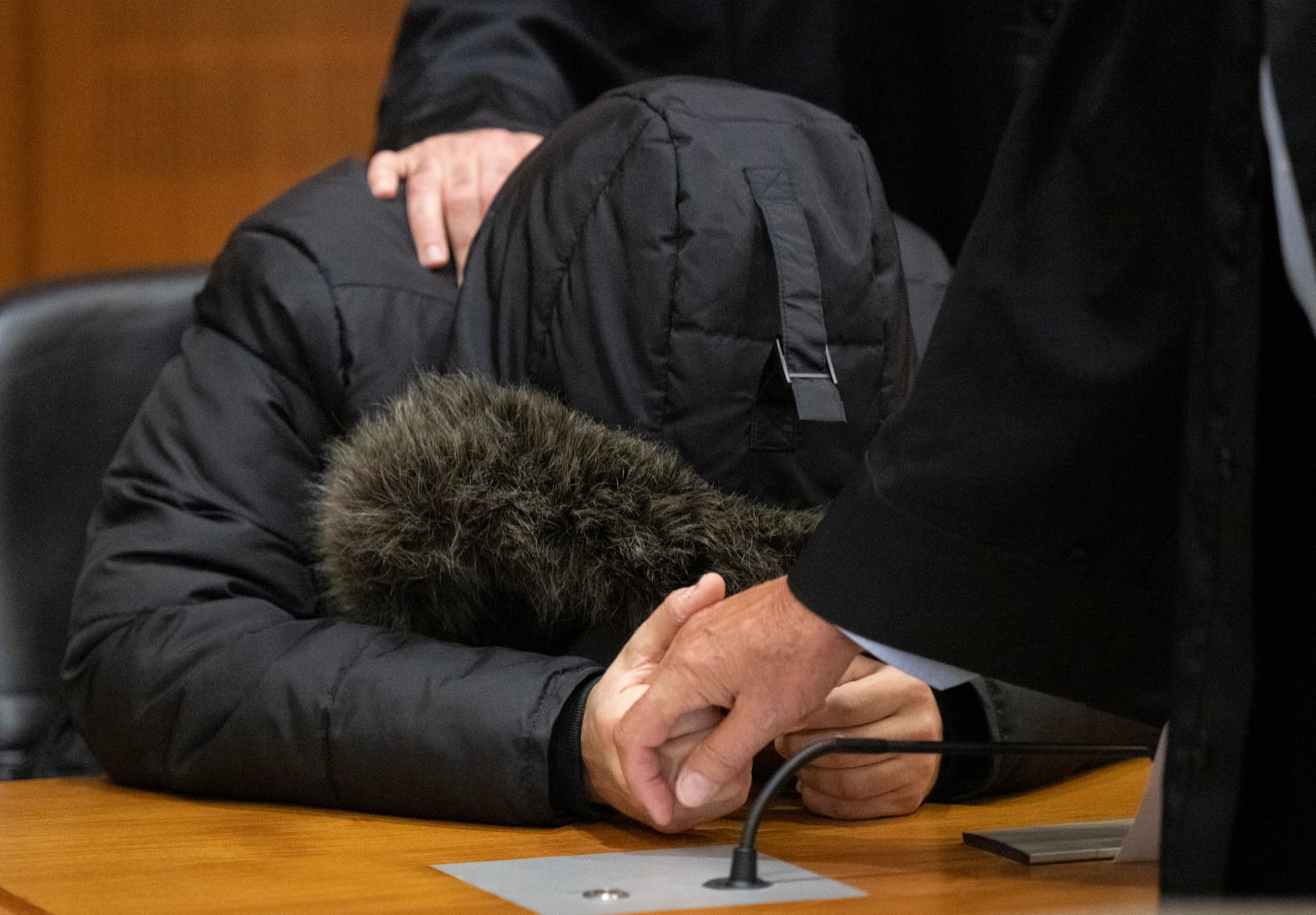 A Syrian doctor, accused of torture and war crimes in his Syrian homeland, sits in the Higher Regional Court before the verdict is announced in Frankfurt, Germany, Monday, June 16, 2025. (Boris Roessler/dpa via AP)