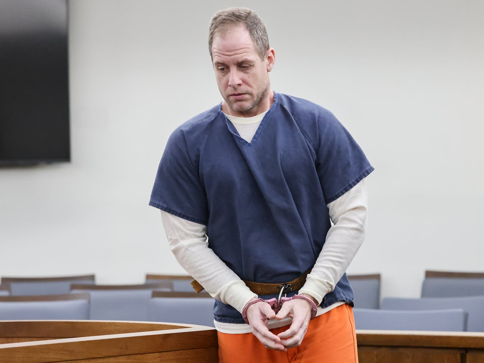 Caleb Flynn walks back to a holding area after appearing in Miami County Common Pleas Court on Thursday, March 19 in Troy. BRYANT BILLING / STAFF