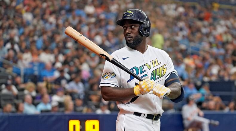 Tampa Bay Rays' Randy Arozarena waits on deck near the new MLB pitch clock during the sixth inning of a baseball game against the Detroit Tigers Thursday, March 30, 2023, in St. Petersburg, Fla. (AP Photo/Chris O'Meara)