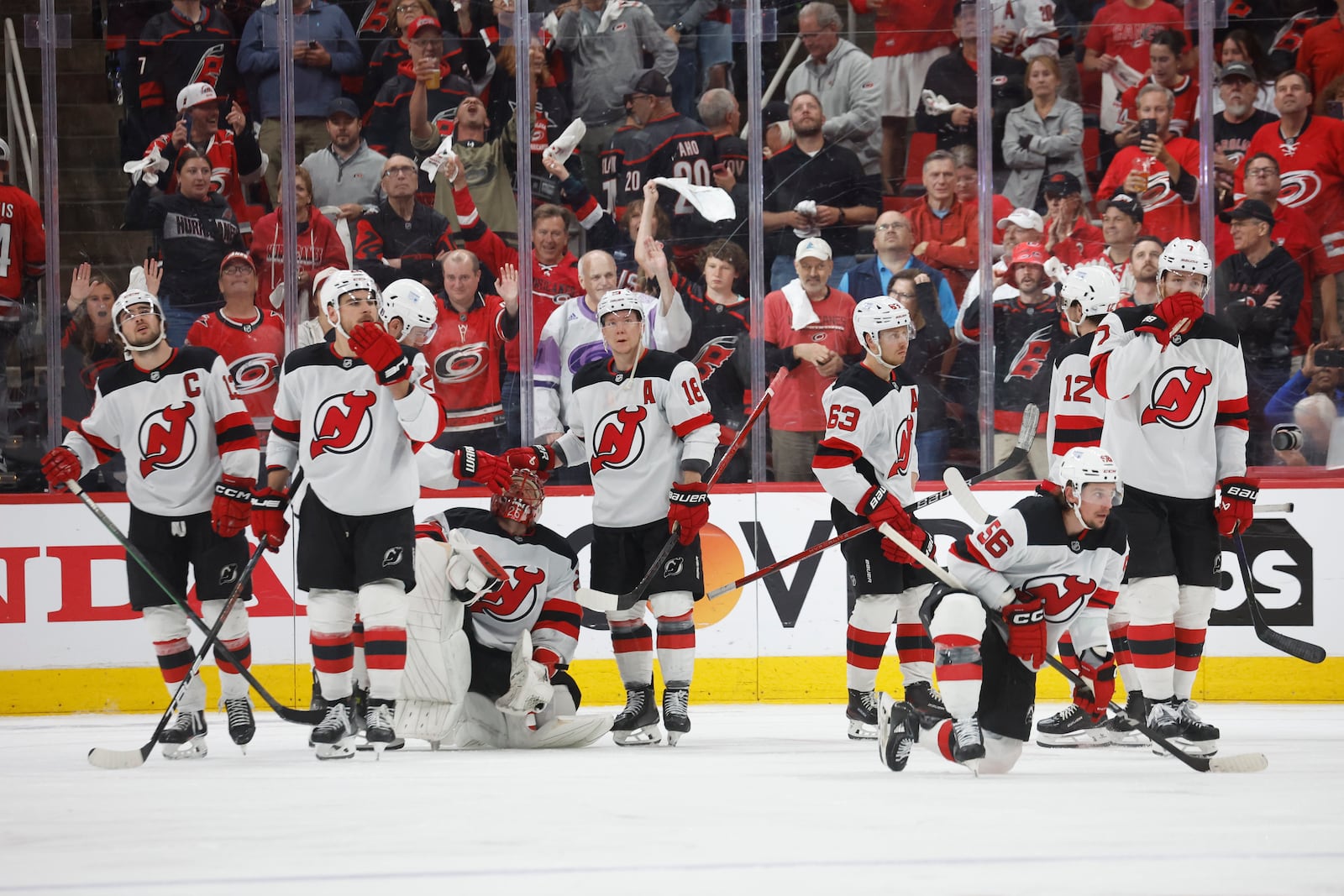 New Jersey Devils react following their overtime loss to the Carolina Hurricanes during the second overtime period of Game 5 of an NHL hockey Stanley Cup first-round playoff series in Raleigh, N.C., Tuesday, April 29, 2025. (AP Photo/Karl DeBlaker)