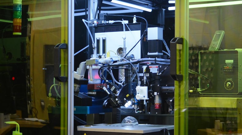 Researchers at the Materials and Manufacturing Directorate, Air Force Research Laboratory, have demonstrated the ability to print solar cells on three-dimensional surfaces using a modified aerosol spray printer. The ability to print three dimensionally opens the aperture for future application of solar cells on diverse surfaces for sensors, robotics and more. (U.S. Air Force photo/David Dixon)