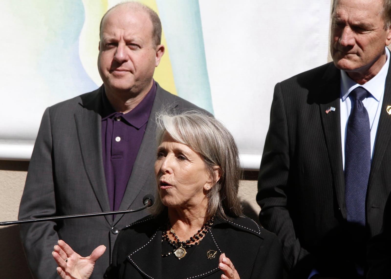 Governor Michelle Lujan Grisham of New Mexico, center, watched by Governors Kelley Armstrong of North Dakota, right, and Jared Polis of Colorado, talks about priorities for affordable housing and public lands in Santa Fe, N.M., on Monday, June 23, 2025, at a meeting of the Western Governor's Association. (AP Photo/Morgan Lee)