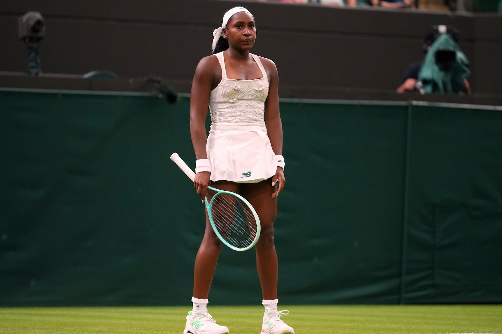 Coco Gauff of the U.S. reacts after losing her first round women's single match against Dayana Yastremska of Ukraine at the Wimbledon Tennis Championships in London, Tuesday, July 1, 2025.(AP Photo/Kirsty Wigglesworth)