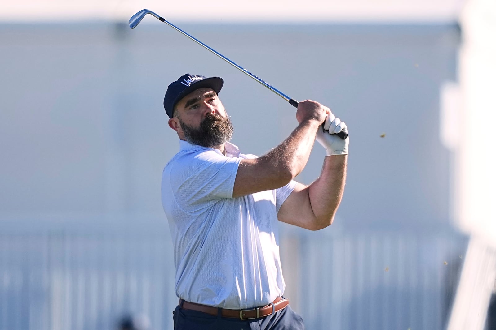 Former Philadelphia Eagles football player Jason Kelce watches his shot on the 16th hole during a pro-am before the Truist Championship golf tournament at the Philadelphia Cricket Club, Wednesday, May 7, 2025, in Flourtown, Pa. (AP Photo/Matt Rourke)