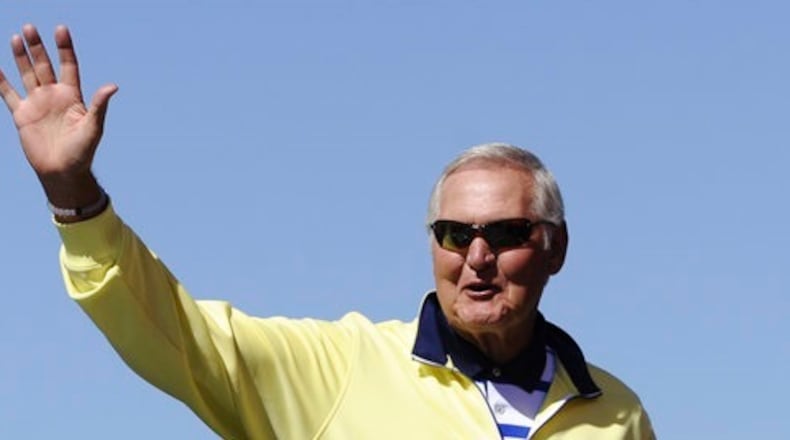 In this Sept. 20, 2015, file photo, former NBA player Jerry West greets fans during drivers introduction for the NASCAR Sprint Cup Series auto race at Chicagoland Speedway in Joliet, Ill. West could be leaving his job as an adviser to the NBA champion Golden State Warriors to take a similar role with the Los Angeles Clippers. West told ESPN he's intrigued at the prospect of working for team owner Steve Ballmer, whom he calls "a winner." (AP Photo/Matt Marton, File)