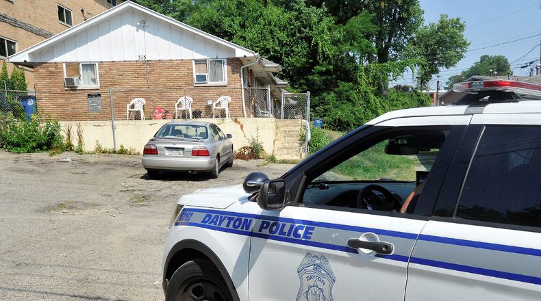 At least two people were injured in a stabbing on North Smithville Road in Dayton Thursday moning. STAFF PHOTO / MARSHALL GORBY