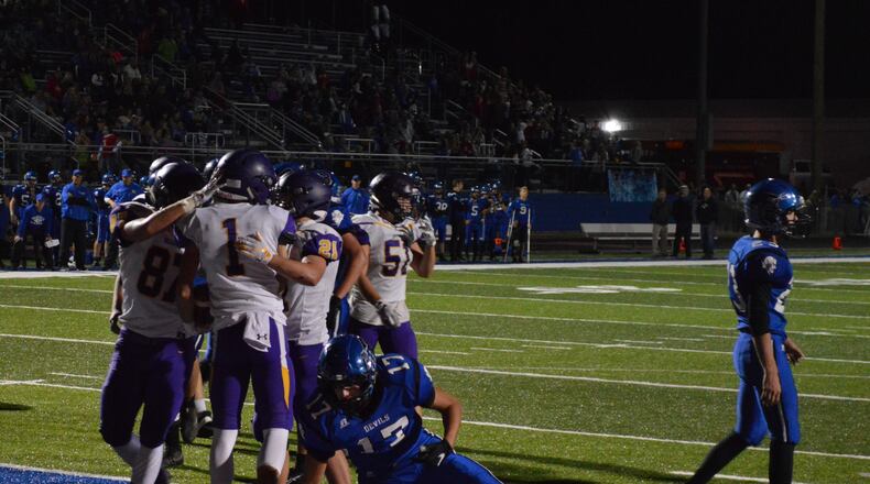 Bellbrook’s Seth Borondy celebrates his second touchdown with teammates during Friday night’s game vs. Brookville. Eric Frantz/CONTRIBUTED